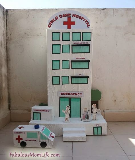 DIY cardboard box hospital model Cardboard Hospital, Ambulance Craft, Hospital Model, Cardboard Box Houses, Cardboard City, Escuela Diy, Hospital Building, Carton Diy, Building Crafts