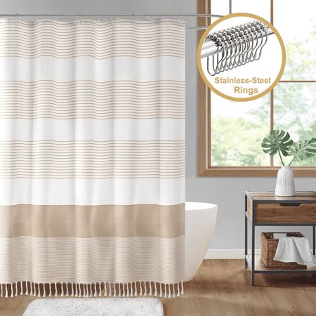 Elevate your daily bathing routine with the ComfiTime Tassel Shower Curtain with Stainless-Steel Shower Rings, a harmonious blend of quality, durability, style and functionality. The horizontal stripe pattern adds a touch of simplicity, while the 4-inch tassel accents infuse a subtle boho-chic charm. The heavy-duty 170 GSM fabric and rust-proof shower rings ensures long-term performance. Nicely packaged, it is also a perfect gifting option for your family and friends. The water-repellent feature ensures a dry and fresh bathroom, and its machine-washable design simplifies maintenance, guaranteeing a pristine and stylish look that withstands the test of time. Our shower curtain strikes the perfect balance between thickness and subtle translucency. Imagine the soft glow of light as you step i Taupe And Age Shower Curtain, Tassel Shower Curtain, Pin Stripe Shower Curtain, Boho Farmhouse Bathroom, Aqua Beige Grey Shower Curtain Striped, Western Shower Curtain Walmart, Fresh Bathroom, Bathing Routine, Modern Farmhouse Shower Curtain Bed Bath & Beyond