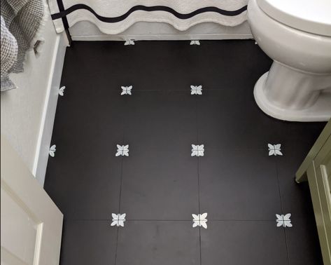 The 10 Best Painted Tile Floor DIYs We’ve Ever Seen Painted Bathroom Floor Ideas, Painting Porcelain Tile Floor, Painting Tiles Black And White, Black And White Tile Design, Paint Floor Tile Diy, Painted Concrete Laundry Room Floor, Painting Exterior Tile Floors, Painted Tile Floor Bathroom, Diy Bathroom Floor Peel And Stick