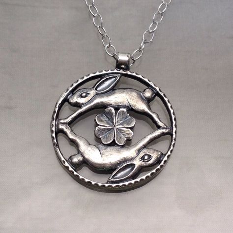 "Made to order: please allow two to three weeks for your pendant to be made. This beautiful pendant was carved by Carrie and cast in Sterling Silver. The whimsical image of rabbits leaping over clover is carved on both sides of the pendant. It has an antiqued finish with polished highlights. The pendant measures approximately 1 1/8\" across (1 1/4\" with the bail). It hangs on an oval link chain that is 2.7mm wide and 18\" long." Bunny Jewelry, Rabbit Jewelry, Rabbit Pendant, Search Bar, Chinese Zodiac, Scottsdale Az, Leaf Clover, Animal Jewelry, Pretty Jewellery