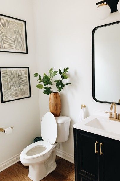 Half Bathroom Light Fixtures, White Half Bathroom Ideas, Small Powder Room Ideas Modern, White Half Bathroom, Half Bathroom Ideas Modern, Black And White Half Bathroom, Modern Half Bathroom Ideas, Black Half Bathroom, Modern Half Bathroom