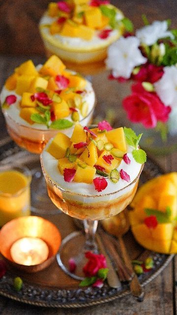 Deeba Rajpal on Instagram: "Mango Rasmalai Trifle... A delightful eggless dessert that brings two favourites together. You guessed it - mangoes and rasmalai! (Recipe on @pabrecipes) Like I said, I can't get enough of the mango season and am amazed we are still getting plenty of the luscious fruit. Here's another scrumptious mango based dessert. It's a simple pistachio topped sponge soaked in the most delicious rasmalai or saffron milk, covered with thickened cream and mangoes. The trifle is Mango Rasmalai, Rasmalai Recipe, Saffron Milk, Thickened Cream, Eggless Desserts, Indian Cooking, Trifle, I Said, Summer Recipes