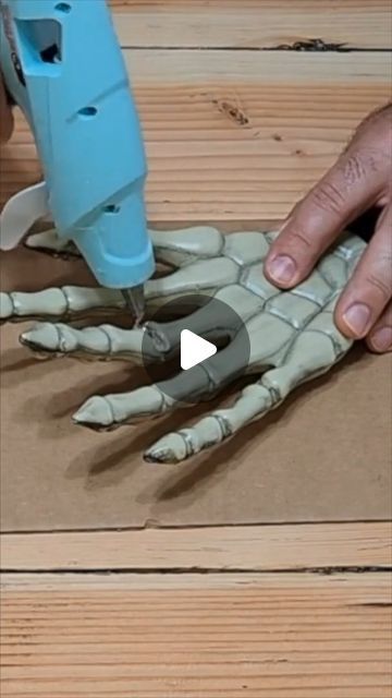 Hometalk on Instagram: "Grab 5 Dollar Tree skeleton hands...💀🧙‍♀️🎃👻" Diy Scary Halloween Hands, Skeleton Hand Halloween Decor, Dollar Halloween Diy, Scary Halloween Wall Decor, Tree Stump Halloween Ideas, Diy Skeleton Head Decor, Diy Skeleton Coming Out Of Mirror, Decorate Skeleton Ideas, Diy Skeleton Picture Frame