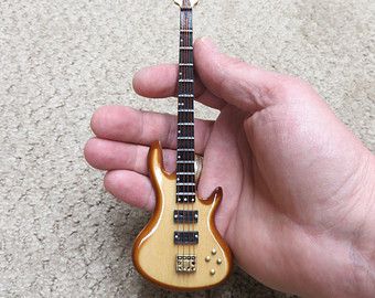 Miniature Bass Guitar - Personalized - Music gift (CBG18NW) Clay Guitar, Miniature Instruments, Bass Guitar Case, Modern Miniatures, Guitar Jewelry, Guitar Display, Miniature Guitars, Mini Guitar, Acoustic Guitar Strings