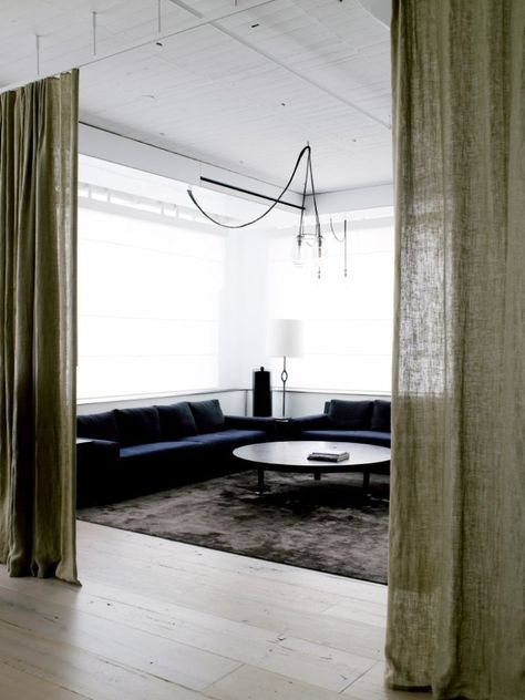 Downstairs by fireplace- curtain divider. A nice way to divide up a open floor plan. ~REB Fearon Hay, Studio Apartment Room Divider, Curtain Divider, Nyc Loft, Tribeca Loft, Diy Room Divider, Loft Stil, Room Divider Curtain, Decor Studio