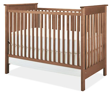 Inspired by Arts & Crafts style, the Nest crib is built by one of the few remaining U.S. family-owned crib makers. It features solid wood construction and a non-toxic lacquer. Modern Nest, Bed Board, Toddler Bed Frame, Crib Design, Modern Kids Furniture, Bed Rails For Toddlers, Room And Board, Modern Crib, Crib Rail Cover