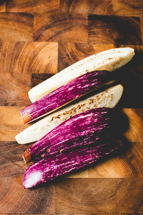 If you are like me, you need a good recipe to handle the absurd number of baby heirloom eggplants you buy during the summer months. Especially, those sweet little Fairy Tale eggplants. With purple and white stripes and a miniature form, they are completely irresistible. I buy a basket of the adorable veggies from every vendor who sells them at the farmers market. Am I alone? Fairy Eggplant, Mini Eggplant Recipe, Baby Eggplant Recipes, Fairytale Eggplant, Eggplant Side Dishes, White Eggplant, Baby Eggplant, Eggplant Recipes Easy, Small Eggplant