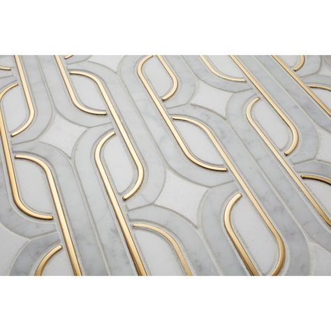 Feast your eyes on the gorgeous Moderne Deco stone mosaic tile, perfect for various parts of the home, whether it be an accent wall or stunning kitchen backsplash. The stone mosaic is brought to life with an Art-Deco-inspired design. A glimmer of metal peeks out from the marble mosaic, creating a simple yet contemporary piece. Metallic Tiles Kitchen, Art Deco Backsplash, Art Deco Bathroom Tile, Modern Mosaic Tile, Bar Tile, Mosaic Tile Kitchen, Mosaic Tile Patterns, Art Deco Tiles, Gold Tile