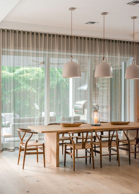 #interiordesign #luxurydesign #architecture #textiles #wishbone Hanging Lights Over Dining Table, Dining Table Lamps Hanging, Carl Hansen Chair, Wishbone Chair Dining Room, Wishbone Chair Dining, Lounge Ceiling Lights, Lights Over Dining Table, Natural Dining Room, Norman Copenhagen