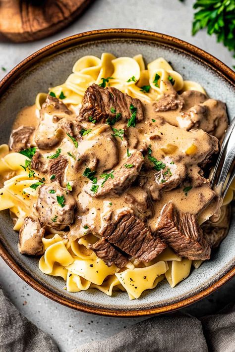 Beef Stroganoff with Egg Noodles Homemade Beef Stroganoff With Steak, Authentic Beef Stroganoff, Beef And Egg Noodles, Traditional Beef Stroganoff, Frozen Strawberry Lemonade Recipe, Homemade Beef Stroganoff, Sautéed Onions, Beef Stroganoff Recipe, Over Mashed Potatoes