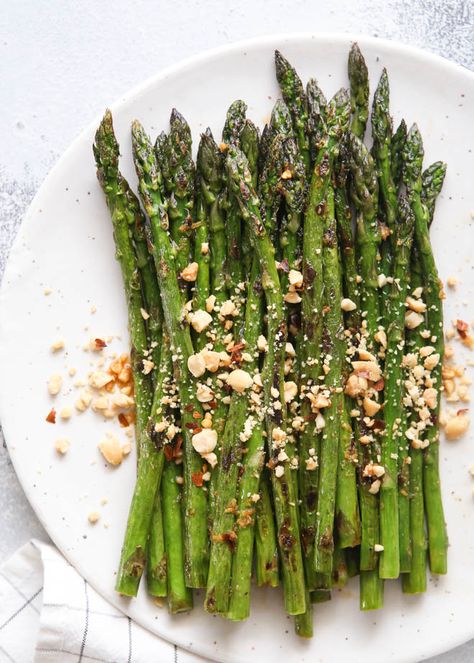 This Asian-inspired sautéed asparagus flavored with a ginger, lime and soy sauce dressing and topped with peanuts is a great side dish! The moment I saw this recipe for “blistered asparagus” in this month’s Bon Appetit magazine I knew I had to try it. At first glance it didn’t sound like much, but when I … Asian Asparagus Recipes, Asian Asparagus, Soy Sauce Dressing, Saute Asparagus, Garlic Mashed Cauliflower, Honey Roasted Carrots, Asparagus Recipes, How To Cook Asparagus, Lime Sauce