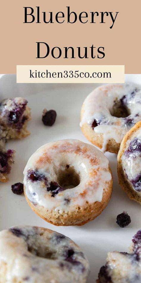 Blueberry Donuts have a fluffy and moist baked donut base loaded with blueberries and glazed in a sweet vanilla glaze. These donuts can be ready in less than 30 minutes and are perfect for breakfast, brunch, or a sweet snack! Blueberry Cake Donuts Baked, Cake Donuts Baked, Blackberry Scones, Blueberry Doughnuts, Donuts Homemade, Blueberry Cake Donuts, Doughnut Recipe Easy, Blueberry Filling, Baked Donut