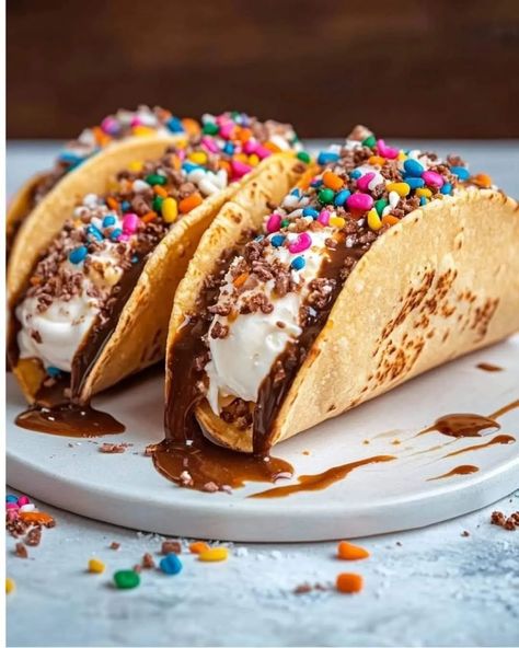 Ice Cream Tacos These delicious Ice Cream Tacos are a fun and unique dessert that’s perfect for impressing guests or satisfying a sweet craving! With soft cinnamon sugar taco shells filled with creamy ice cream and topped with rich chocolate, they’re sure to be a hit. Ingredients For the Taco Shells: 1 package (10 count) flour street tacos 3 tablespoons unsalted butter, melted 1/4 cup Imperial Sugar Extra Fine Granulated Sugar 1 1/2 teaspoons ground cinnamon For the Filling: 1 quart vanill... Taco Ice Cream, Ice Cream Tacos, Cream Tacos, Ice Cream Taco, Creamy Ice Cream, Taco Shells, Delicious Ice Cream, Street Tacos, Unique Desserts