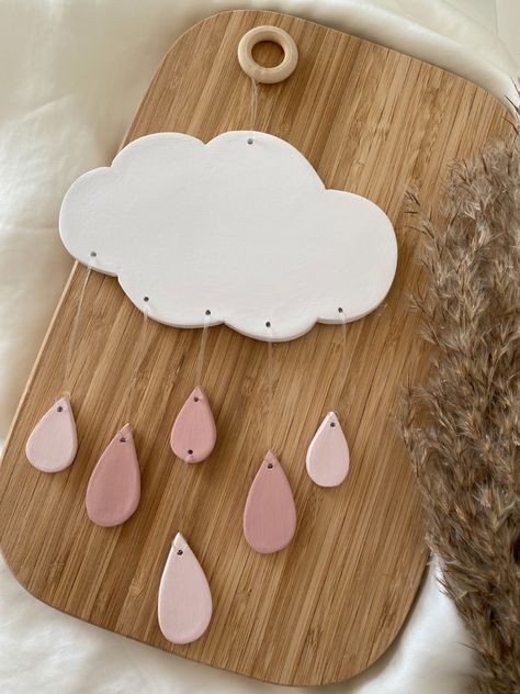 Handcrafted clay cloud and raindrops clay wall hanging🌧️ Air Dry Clay Nursery Decor, Air Dry Clay Wind Chimes Diy, Diy Air Dry Clay Wall Hanging, Clay Nursery Decor, Das Modelling Clay, Air Dry Clay Hanging Decorations, Air Dry Clay Decor Ideas, Ceramic Mobile Ideas, Nursery Ceramics