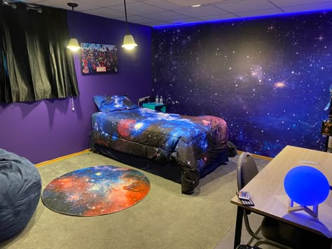 My preteen son outer space bedroom! Wall art, bed spread, rug, led lights and moon lamp all off amazon. Outerspace, universe bedroom, dark purple bedroom, preteen bedroom, boys bedroom, epic bedroom! Galaxy Office Decor, Galaxy Walls Bedroom, Galaxy Wall Bedroom Ideas, Galaxy Room Painting Ideas, Universe Room Ideas Bedrooms, Outer Space Room Ideas, Kids Outer Space Bedroom, Galaxy Painted Wall, Universe Room Decor