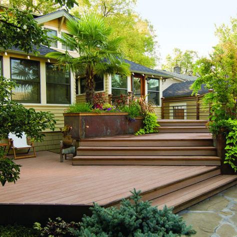 Reinvented living space This home's floor sits 3½ feet above ground, so the deck needed to provide a gradual descent into the garden. Seven steps connect the deck's three levels to a small ground-level patio with a portable fireplace. There's seating on the top and bottom levels, and storage beneath the deck for the couple's canoes.  More ideas from this deck project  Photo: Jon Jensen, Sunset.com Multi Level Deck, Tiered Deck, Deck Projects, House Deck, Deck Plans, Decks Backyard, Diy Deck, Backyard Deck, Exterior Ideas