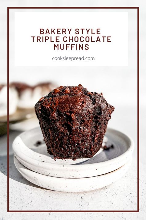 A cut view of the inside of a triple chocolate muffin on a stack of plates. Chocolate Muffins Bakery Style, Triple Chocolate Mini Muffins, Best Chocolate Muffins Moist, Bakery Style Double Chocolate Muffins, Choc Muffins Recipe, Moist Chocolate Muffins Recipe, Jumbo Bakery Style Muffins, Triple Chocolate Muffins Recipe, Jumbo Chocolate Muffins