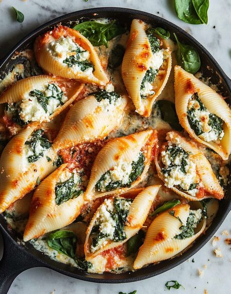 These Spinach Ricotta Stuffed Shells are a delightful mix of creamy ricotta, earthy spinach, and melty mozzarella all baked in a rich marinara sauce. The savory flavors are elevated by ... Read more Spanakopita Stuffed Shells, Spinach Shells Stuffed, Ricotta Recipes Savory, Ricotta Spinach Stuffed Shells, Stuffed Ricotta Shells, Healthy Stuffed Shells, Ricotta Shells, Spinach Ricotta Stuffed Shells, Spinach Cream Sauce