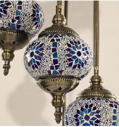 Introducing our exquisite 7 Globes Turkish Mosaic Lamp, meticulously handcrafted to elevate the ambiance of your living space with its timeless elegance. Each globe is a masterpiece, painstakingly assembled from an array of vibrant stained glass pieces, ensuring a lasting allure that transcends trends. The superior craftsmanship extends to the durable metalwork, guaranteeing a rust-free lifespan. Rest assured, every component of our lamps is sourced locally and rigorously tested in USA, ensuring Retail Gift Turkish Lamp And Showpiece, Mosaic Chandelier, Turkish Lights, Turkish Mosaic Lamp, Turkish Mosaic, Turkish Tile, Turkish Lamps, Mosaic Lamp, Beauty Forever