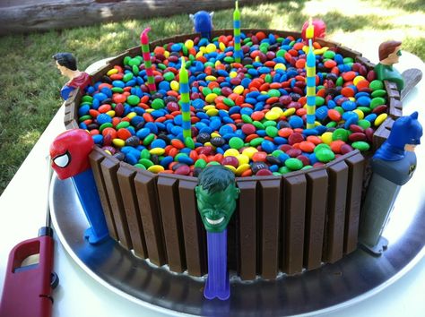 My addition to the standard KitKat Cake.  I used superhero pez despensers, but you could use any theme.  Super easy to do! Kitkat Cake, Hulk Birthday, Superhero Birthday Cake, Superhero Cake, Avengers Birthday, Spiderman Cake, Kids Party Food, Birthday Cake Recipe, Superhero Birthday Party