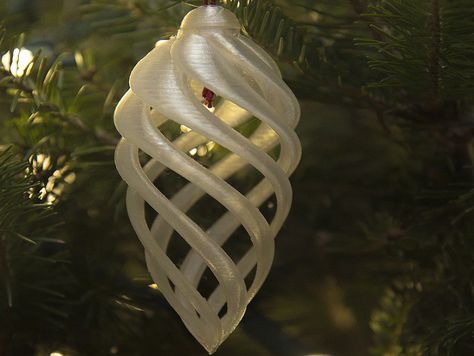 A spiral sort of similar to an icicle. There is a small cap to finish off the top (I super glued it to the main ornament) and a hole through for hanging.    I printed it without any supports hollow, although I had a little droop on the inside of the spiral but not very noticeable unless you look inside.   My other ornament designs  are here: Kelly Egan's ornaments Jul Diy, Pom Pom Wreath, 3d Scanner, 3d Printing Diy, 3d Printer Projects, 3d Printed Objects, 3d Lamp, 3d Printing Projects, 2022 Christmas