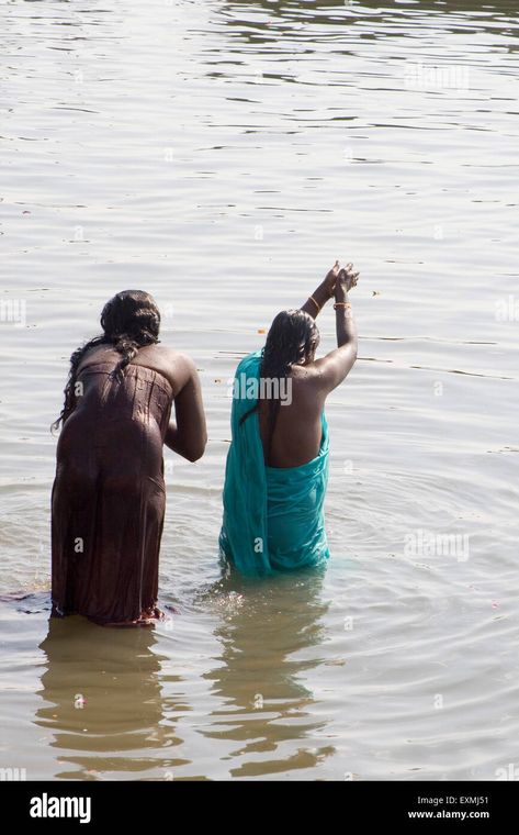 Download this stock image: Women are praying offering to Ganga river during bathe in Varanasi ; Uttar Pradesh ; India - EXMJ51 from Alamy's library of millions of high resolution stock photos, illustrations and vectors. Ganga River, Arc Reactor, Stock Photos Woman, Hot Dresses Tight, Dresses Tight, Beautiful Women Over 40, Varanasi, Uttar Pradesh, High Resolution