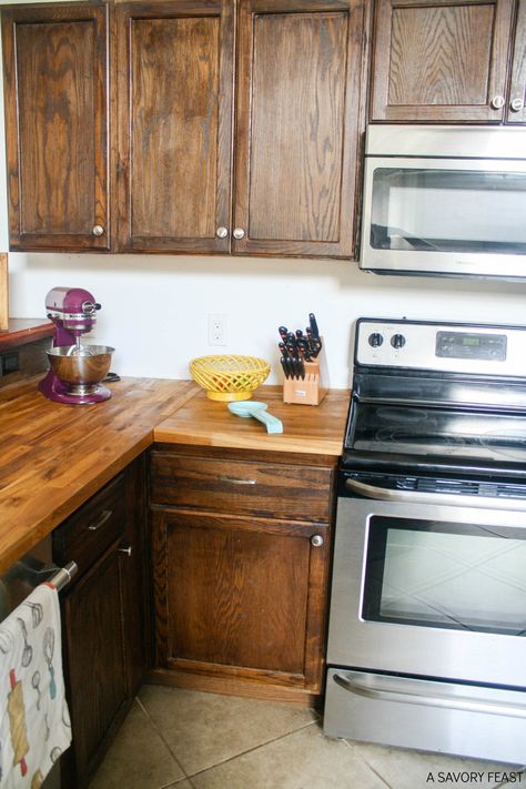 Butcher Block Countertops: My experience after six months, including initial maintenance and everyday use and care. Butcher Block Countertops With Natural Wood Cabinets, Butcherblock Countertop With Oak Cabinets, Butcher Block Countertops On Wood Cabinets, Wood Kitchen Cabinets With Butcher Block, Oak Cabinets Butcher Block Countertops, Butcher Block With Wood Cabinets, Butcher Block Countertops Brown Cabinets, Stained Cabinets With Butcher Block, Dark Green Kitchen Cabinets With Butcher Block Countertops