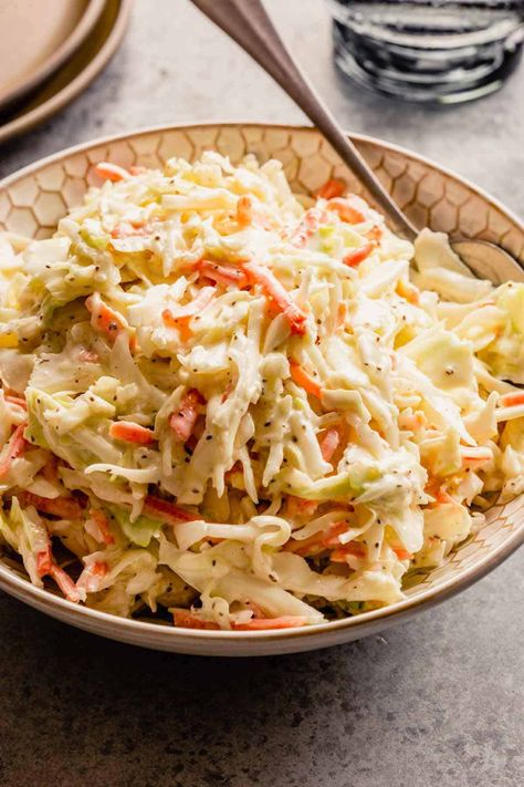 A bowl of creamy coleslaw with a silver spoon on a grey counter. Mexican Coleslaw Recipe, Easy Coleslaw Dressing, Creamy Coleslaw Recipe, Homemade Coleslaw Dressing, Mexican Coleslaw, Creamy Coleslaw Dressing, Classic Coleslaw Recipe, Coleslaw Dressing Recipe, Easy Coleslaw