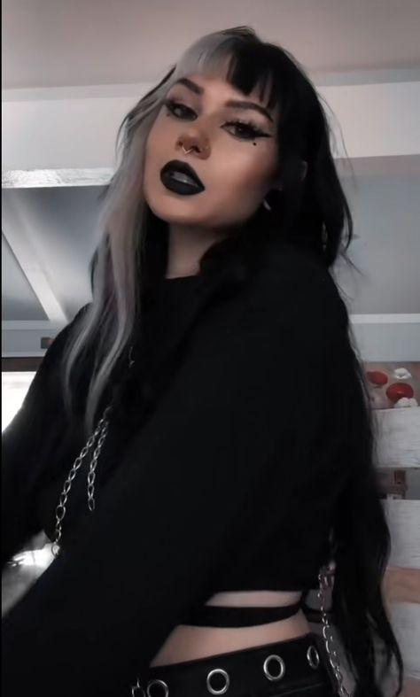 Long goth hair. Black hair with split bangs Black And Silver Split Dye, Black Hair White Streak Bangs, Black And Silver Hair With Bangs, Black Hair And Blonde Bangs, Goth Hair With Bangs, Goth Bangs Long Hair, Black Hair Money Piece Bangs, Black Hair Colored Bangs, Black And White Hair With Bangs