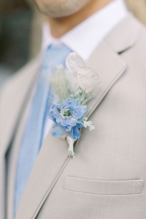 Blue Wedding Theme Suits, Powder Blue Wedding Suit Groom, Powder Blue Boutonniere, Blue And Tan Suit Wedding, Tan Tux With Dusty Blue, Cream And Blue Suits For Men, Tan Suit Light Blue Tie, Light Blue And White Beach Wedding, Pastel Blue Groom Suit