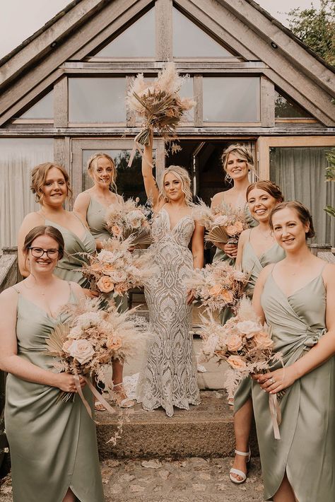 Bride in a boho lace fitted Willowby by Watters wedding dress with the bridal party in sage green satin bridesmaid dresses all holding pink rose and pampas grass bouquets Boho Bridesmaid Dress Sage Green, Rustic Boho Wedding Bridesmaid Dresses, Boho Rustic Bridesmaid Dress, Sage Green Pampas Wedding, Green Bridesmaid Dresses Satin, Boho Wedding Bridesmaids Dresses, Boho Wedding Bridesmaid Dresses, Boho Bridesmaid Dress, Boho Wedding Bridesmaids