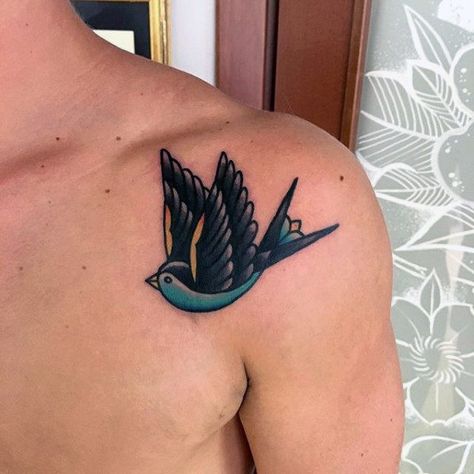 Mens Teal And Black Traditional Flying Swallow Upper Shoulder Tattoo Swallow Tattoo Ideas, Traditional Swallow, Traditional Swallow Tattoo, Upper Shoulder Tattoo, Traditional Tattoo Outline, Swallow Tattoo Design, Bird Tattoos Arm, Bluebird Tattoo, Neotraditional Tattoo