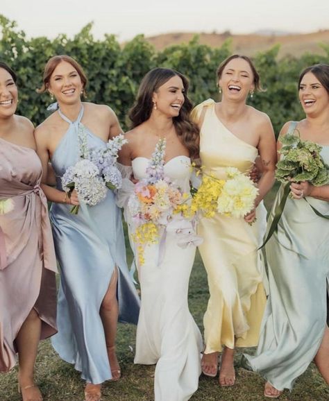 @loverly on Instagram Vogue Wedding Guest Outfit, Summer Garden Bridesmaid Dresses, Wildflower Bridesmaids Dresses, Colorful Wedding Party Attire, Pastel Wedding Guest Outfit, Spring Bridesmaid Dresses Mismatched, Bridesmaid Lineup, Wildflower Bridesmaid Dresses, Wildflower Wedding Bridesmaids