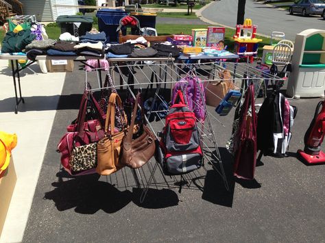 Garage Sale - Display your handbags with shower hooks and a drying rack. Yard Sale Hacks, How To Sell Clothes, Prepper Items, Garage Sale Tips, Sales Ideas, Rummage Sale, Painted Pots Diy, Sale Ideas, Money Savers