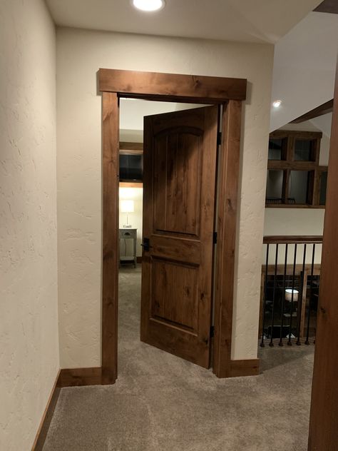 Rustic Door Frame Ideas, Dark Wooden Doors Interior, Rustic Wood Trim Living Room, Living Room Designs Wood Trim, Rustic Bedroom Door, Wood Color Trim, Hickory Doors And Trim, Rustic Wood Door Frame, Rustic Moldings And Trim