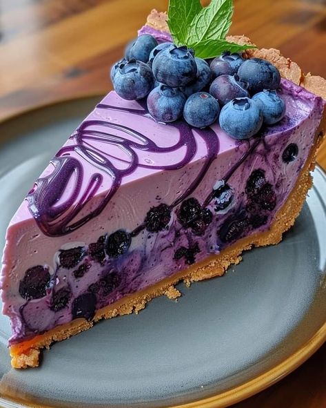 ￼


😋💜🍇  Irresistible Blueberry Dream Cheesecake
Ingredients:
1 1/2 cups graham cracker crumbs
1/2 cup melted butter
2 cups fresh blueberries
3/4 cup sugar
2 tablespoons cornstarch
1 tablespoon lemon juice
3 packages (8 oz each) cream cheese, softened
1 cup sugar
1 teaspoon vanilla extract
3 large eggs
1/2 cup sour cream
Fresh blueberries and mint leaves for garnish
Directions:

Preheat oven to 325°F (165°C). Grease a 9-inch springform pan.
In a medium bowl, mix graham cracker crumbs and melted butter. Press mixture firmly into the bottom of the prepared pan to form a crust.
In a saucepan, combine 2 cups blueberries, 3/4 cup sugar, cornstarch, and lemon juice. Cook over medium heat until the mixture thickens, about 10 minutes. Set aside to cool.
In a large mixing bowl, beat the cream ch Cheesecake Ingredients, No Bake Blueberry Cheesecake, Caramel Apple Cheesecake, 귀여운 음식 그림, Enjoy Your Meal, Fruity Desserts, Blueberry Cheesecake, Cream Cheese Filling, Graham Cracker Crumbs