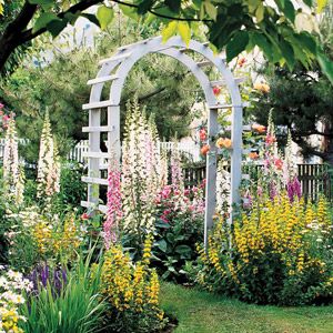 Lovely contrast between the bright flowers and the white arbor. Rustic Arbor, Arbors Trellis, English Gardens, Garden Arbor, Garden Entrance, Flower Garden Design, Longwood Gardens, English Cottage Garden, Charming Garden