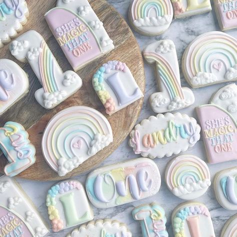 Erica on Instagram: "All the sweet rainbow designs for miracle baby, Landry, on her first birthday! #rainbowcookies #rainbowbabycookies #rainbowbirthday #rainbowbirthdaycookies #firstbirthday #firstbirthdayparty #firstbirthdaycookies #decoratedcookies #royalicingcookies #ohiocookier #ohiobakery #ohiocookies #mamamungaibakes" One Year Old Rainbow Birthday Party, First Birthday Pastel Rainbow Theme, Pastel First Birthday Cookies, First Birthday Color Theme, Rainbow Theme Cookies, Pastel Rainbow Birthday Theme, Pastel First Birthday Party Decor, Rainbow First Birthday Theme, Rainbow Theme First Birthday Girl