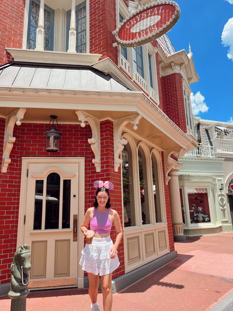 cute and simple outfit inspiration for walt disney world. girly and summer aesthetic. girl wearing a white lace skirt with a tank top and minnie moyse ears. drinking coffee on main street usa. Magic Kingdom Outfit, White Lace Skirt, Disney World Outfits, Main Street Usa, Girls Wear, Magic Kingdom, White Skirts, Main Street, Disney Outfits