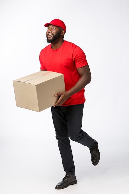 Free Photo | Delivery concept - portrait of handsome african american delivery man or courier pushing hand truck with stack of boxes. isolated on grey studio background. copy space. Mannequin Design, Human Png, Red Carpet Background, Grey Studio, Ancient Paper, Lady Logo, Menu Card Design, Delivery Pictures, Short Box Braids Hairstyles