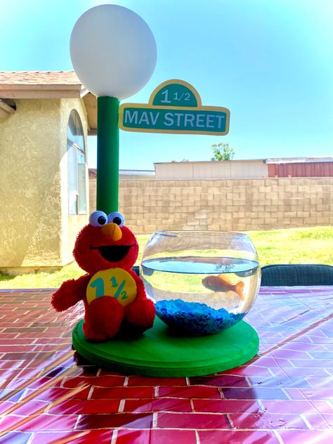 Elmo Safari Birthday, Elmo Party Centerpieces, Diy Sesame Street Centerpieces, Elmo’s World 1st Birthday, Elmo Centerpiece Ideas 2nd Birthday, Elmo Pool Party, Elmo Centerpiece Ideas 1st Birthday, Elmos World Party, Elmos World Birthday Party Boy