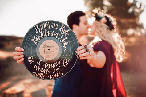 vintage vinyl record with calligraphy quote for engagement session Engagement Signs For Pictures, Engagement Calligraphy, Record Quotes, Country Engagement Pictures, Mark Ballas, 50s Wedding, Nativity Stable, Calligraphy Quote, Engaged Couples Photography