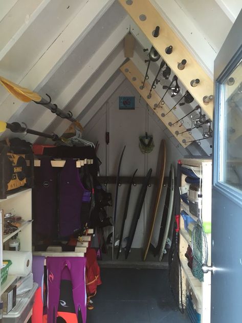 Water Ski Storage Rack, Lake Towel Storage, Beach House Storage Shed, Lake House Storage Room, Lake House Fishing Decor, Fishing Shed Ideas, Lake Shed Storage Ideas, Life Vest Storage, Boat Shed Storage