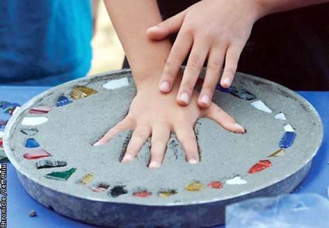 Jonathan, 9, imprints his hand as a finishing touch as he makes an individual concrete stepping stone on Tuesday afternoon in San Jose. Photo by Jeff Chiu / The Chronicle. Photo: Jeff Chiu Stepping Stones Kids, Stepping Stone Molds, Stepping Stones Diy, Concrete Stepping Stones, Mosaic Stepping Stones, Stone Molds, Garden Stepping Stones, Garden Steps, Concrete Steps