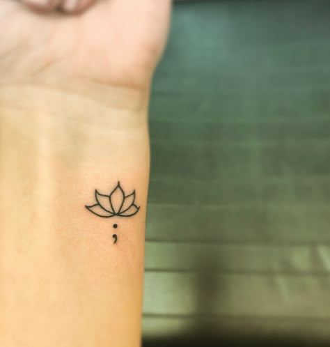 Small Tattoos Simple Semi Colon, Tattoo Ideas Meaning For Mom, Semi-colon Tattoo Lotus, Lotus Aesthetic Tattoo, Lotus Flower Tattoo Semi Colon, Lotus Flower Tattoo With Semi Colon, Lotus And Semicolon Tattoo, Aesthetic Semi Colon Tattoos, Discreet Semi-colon Tattoo Ideas