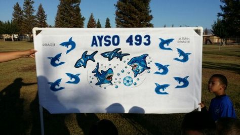 2014 AYSO Soccer Banner We were the Blue Sharks all the sharks were made from felt material and the detail designs were made with puff paint ☺😀 Ayso Soccer Banner, Ayso Soccer, Soccer Banners, Soccer Banner, Puff Paint, Blue Shark, Felt Material, Soccer Mom, Sharks