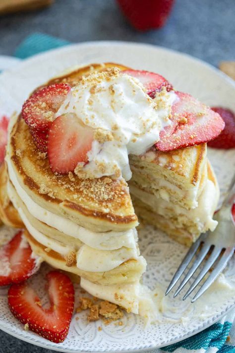 Pancakes for breakfast or dessert! These fluffy Cheesecake Pancakes are topped with a cream cheese frosting for a fun and delicious treat. Stuffed Cheesecake Pancakes, Cream Cheese Stuffed Pancakes, Cream Cheese Topping For Pancakes, Cheesecake Pancakes Recipe, Pancakes Cream Cheese, Cream Cheese Waffles, Cheesecake Pancakes, Fluffy Cheesecake, Cream Cheese Pancakes