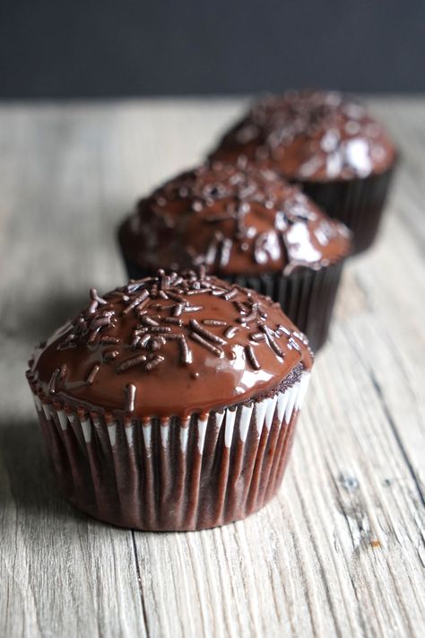 Dark chocolate cupcakes with ganache are super decadent, chocolaty cupcakes topped with chocolate ganache and chocolate sprinkles. Perfect for the chocolate lover! Chocolate Ganache For Cupcakes, Dark Chocolate Cupcake Recipes, Chocolate Cupcakes With Ganache, Cupcakes With Ganache, Filled Chocolate Cupcakes, Ganache Cupcakes, Chocolate Ganache Cupcakes, Homemade Chocolate Cupcakes, Dark Chocolate Cupcakes