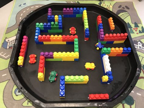 EYFS tuff spot car maze made from duplo bricks Construction Tuff Tray Eyfs, Early Years Transport Activities, Eyfs Construction Activities, Under 2s Activities Eyfs, London Activities Eyfs, Cars Tuff Tray Ideas, Cars Eyfs Activities, Toys Topic Eyfs, Car Tuff Tray Ideas