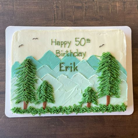 Mountains and evergreen trees made of American buttercream adorn this gluten-free choclate sheet cake to reflect the interests and passions of the recipient. Cake Decorating Mountains, Camping Theme Sheet Cake, Outdoor Theme Cake, Camping Sheet Cake, One Happy Camper Sheet Cake, Hiking Birthday Cake, 60th Birthday Sheet Cake, Woodland Sheet Cake, Mountain Cake Ideas